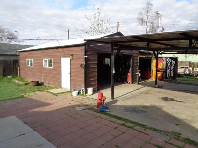 1084 Cyrier Avenue Reedley, CA 93654 - Photo 8 of 11 a view of a house with a patio