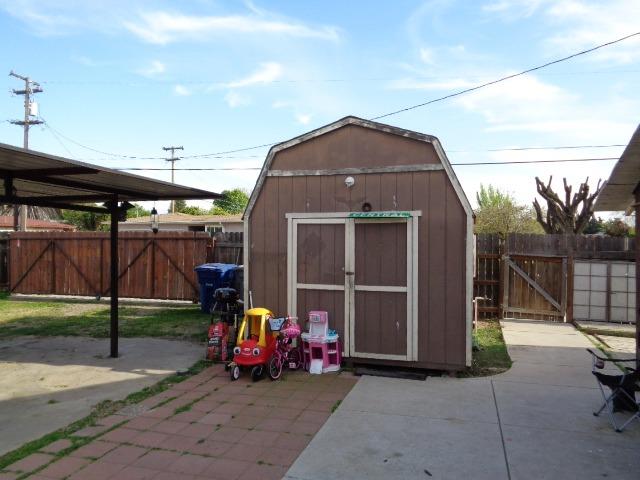1084 Cyrier Avenue Reedley, CA 93654 - Photo 9 of 11 a view of a car garage