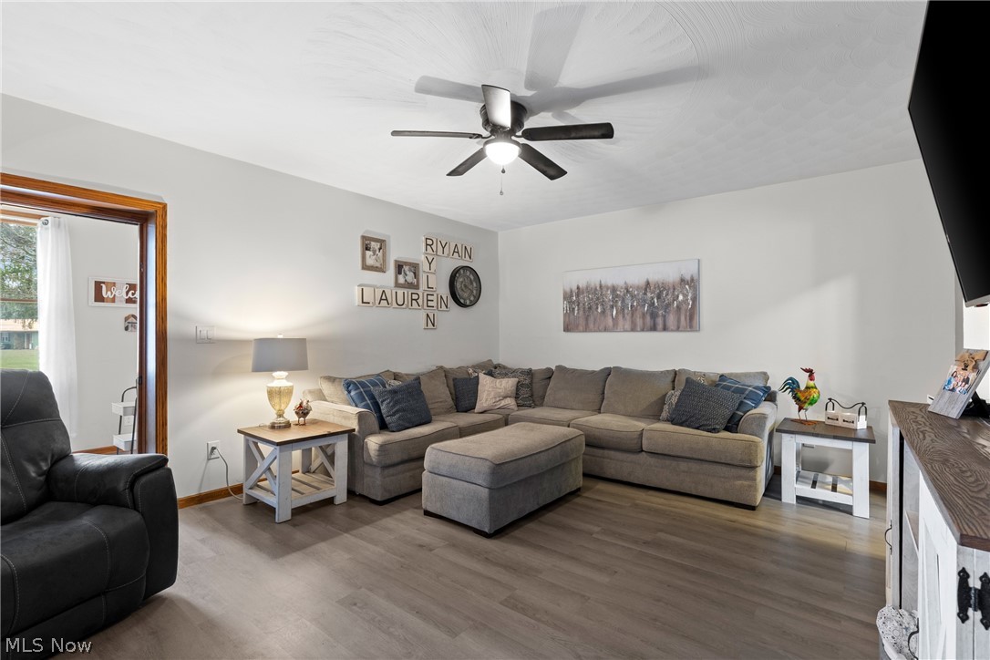 64508 Slade Road Cambridge, OH 43725 - Photo 7 of 50 Living room featuring wood finished floors and ceiling fan