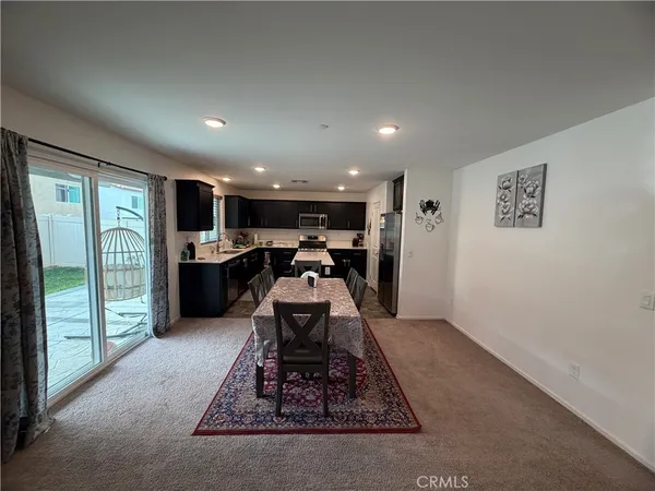 a living room with furniture and a rug