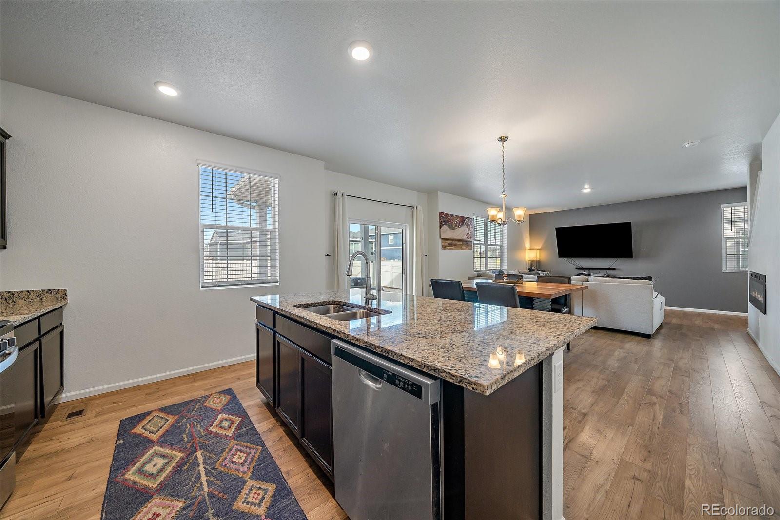 10097 Cedar Street Firestone, CO 80504 - Photo 12 of 37 a kitchen with sink stove and refrigerator