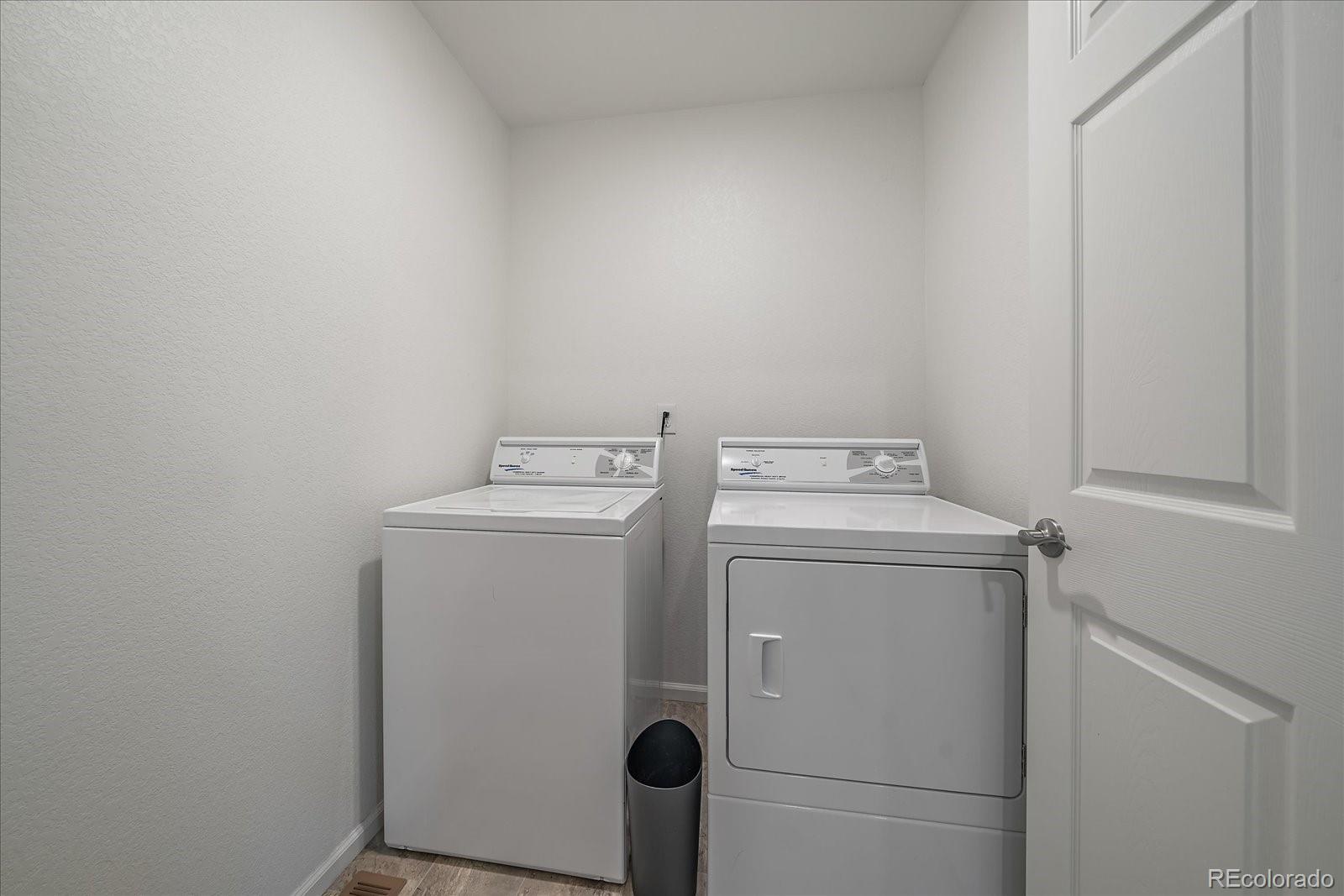 10097 Cedar Street Firestone, CO 80504 - Photo 27 of 37 a utility room with dryer and washer