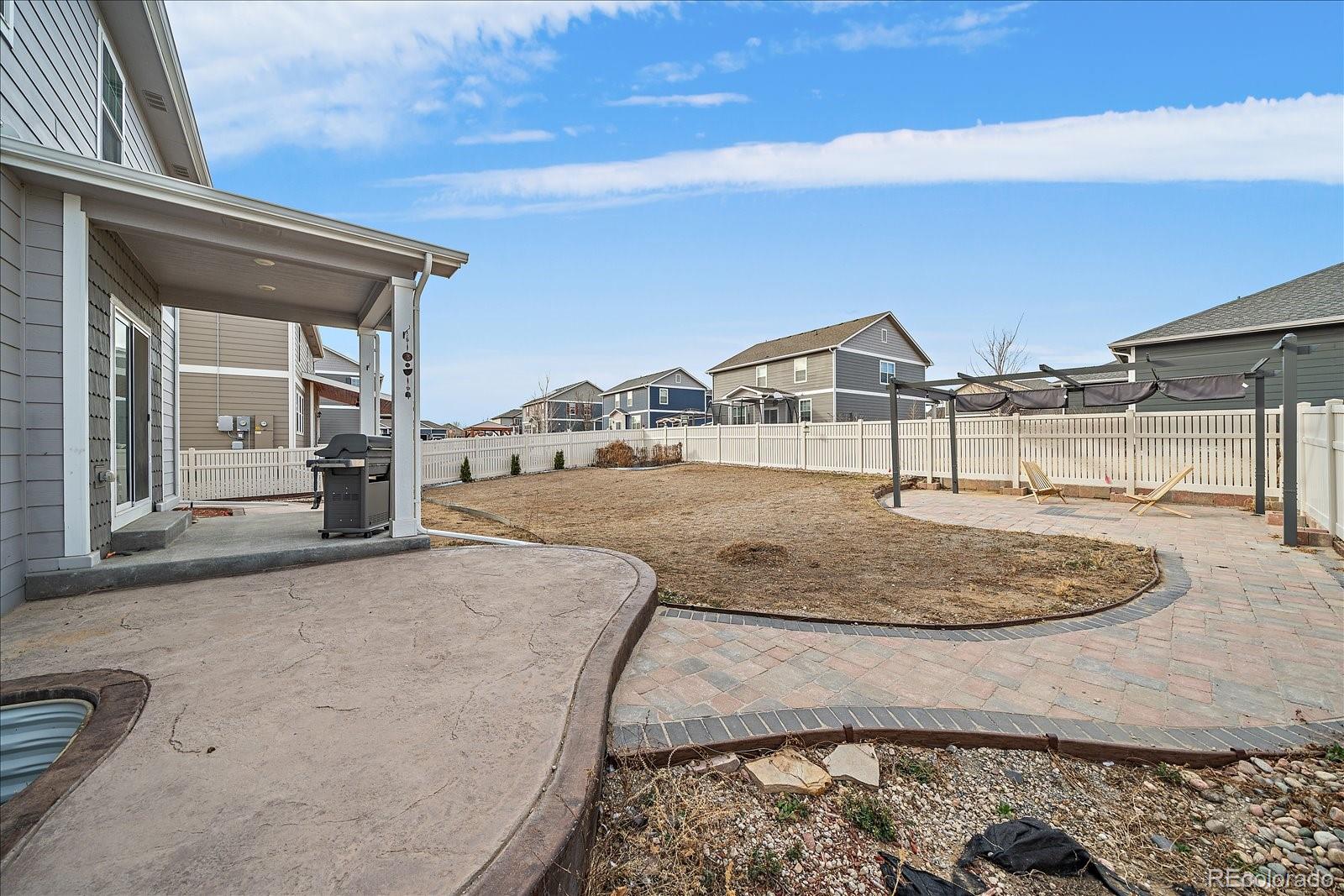 10097 Cedar Street Firestone, CO 80504 - Photo 29 of 37 a view of a house with a entertaining space