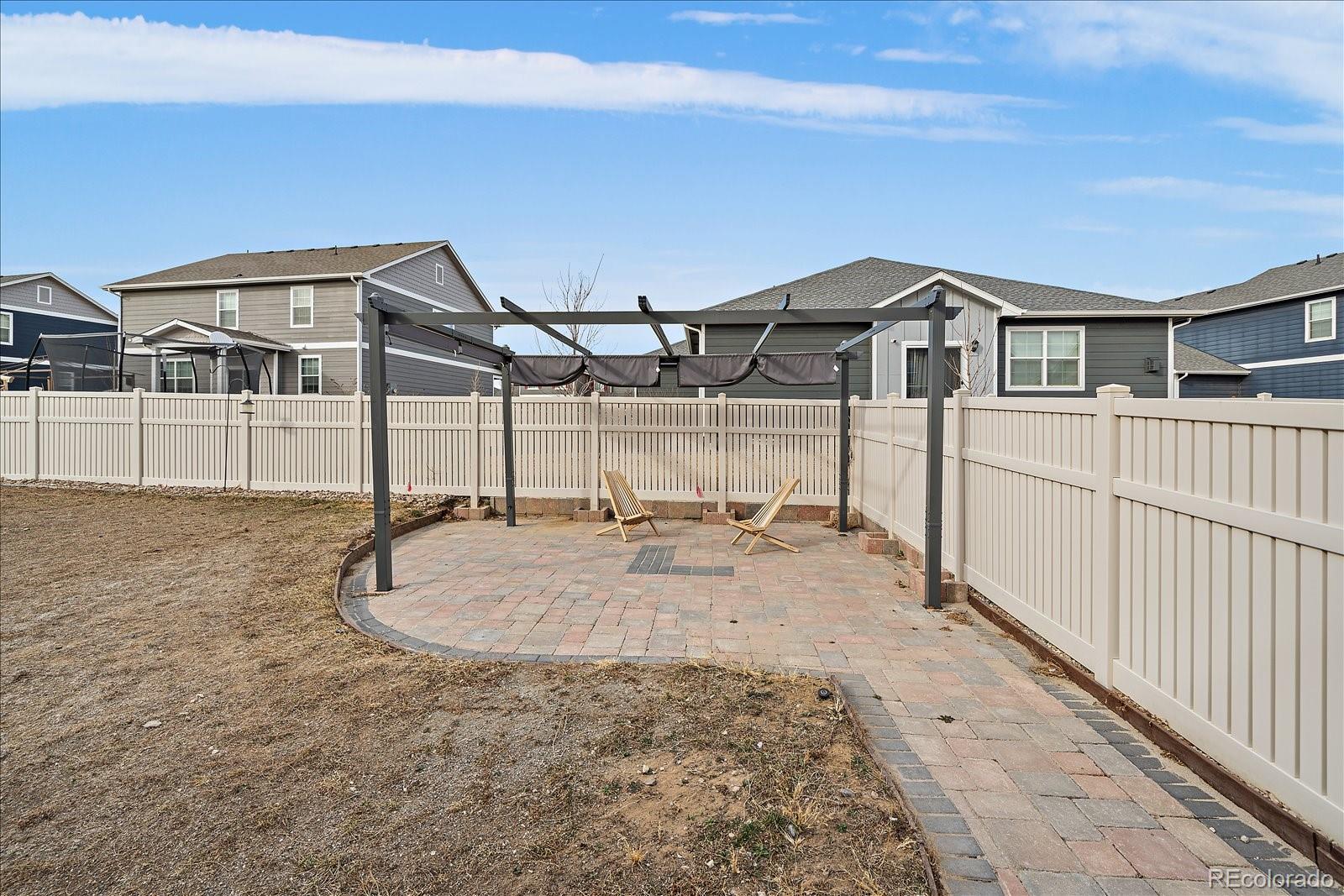 10097 Cedar Street Firestone, CO 80504 - Photo 30 of 37 a view of a house with wooden fence