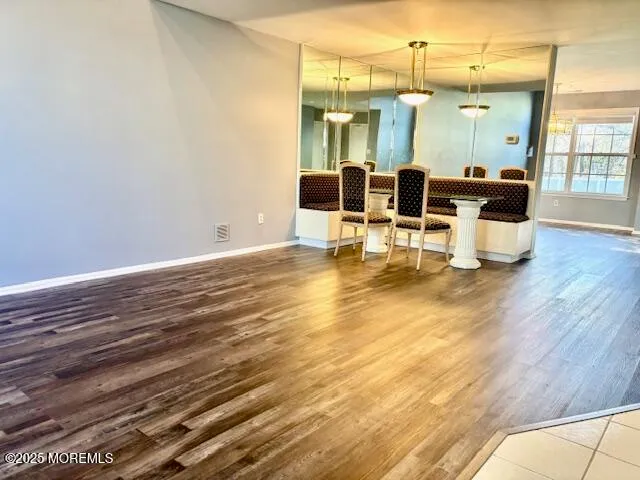 a view of a swimming pool with seating space