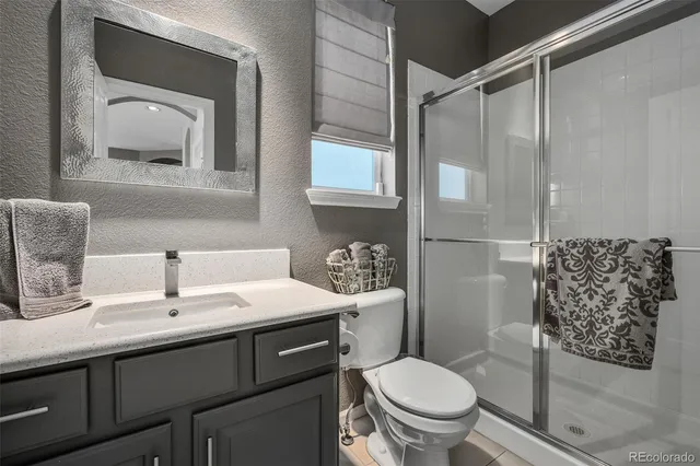 a spacious bedroom with a bed and a window