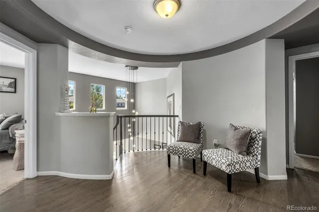 a bed room with a bed television and a large window