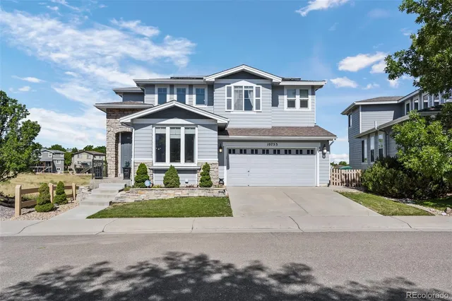 front view of a house with a garden