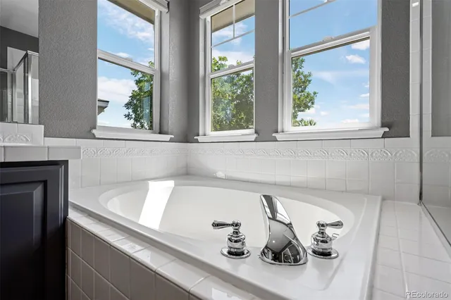 a bedroom with a bed a desk and chair