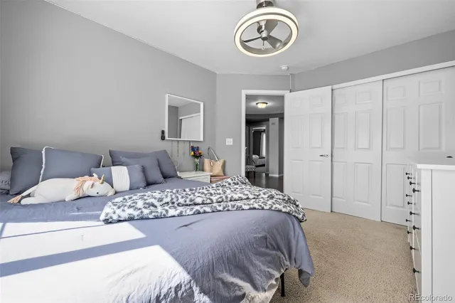 a bed room with a bed and a window