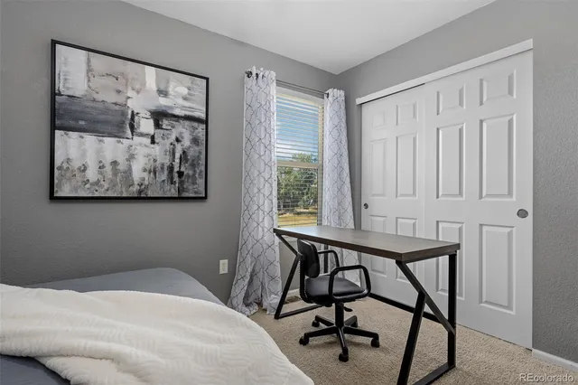 a bathroom with double vanity sinks and a mirror