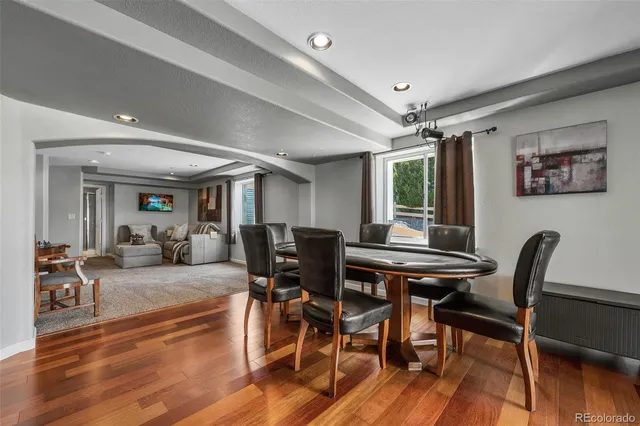 a front view of a house with a yard and potted plants