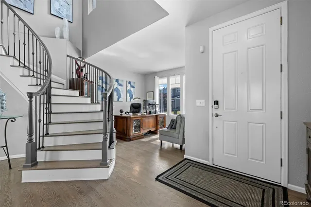 a living room with fireplace furniture and a flat screen tv