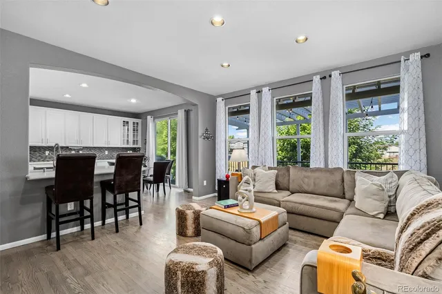 a work room with furniture and a potted plant