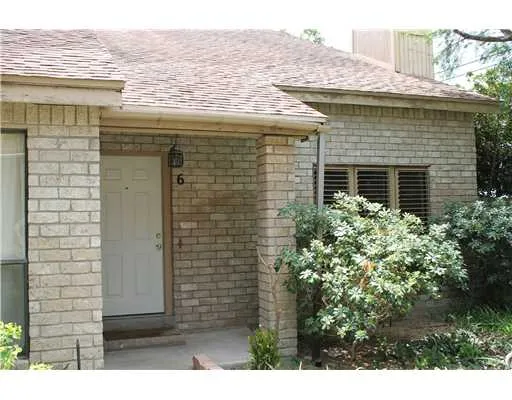 a view of house with backyard space and garden