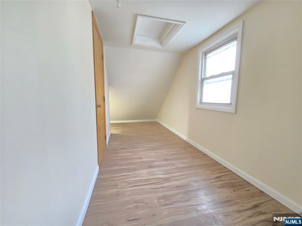 701 4th Street Secaucus, NJ 07094 - Photo 17 of 21 an empty room with wooden floor and windows