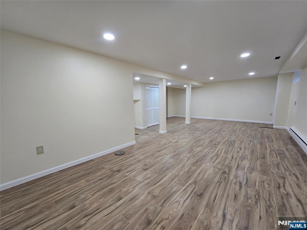 701 4th Street Secaucus, NJ 07094 - Photo 19 of 21 a view of an empty room with wooden floor