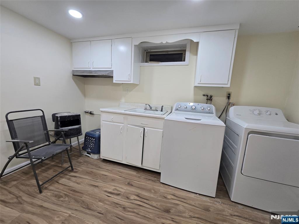 701 4th Street Secaucus, NJ 07094 - Photo 20 of 21 a utility room with sink dryer and washer