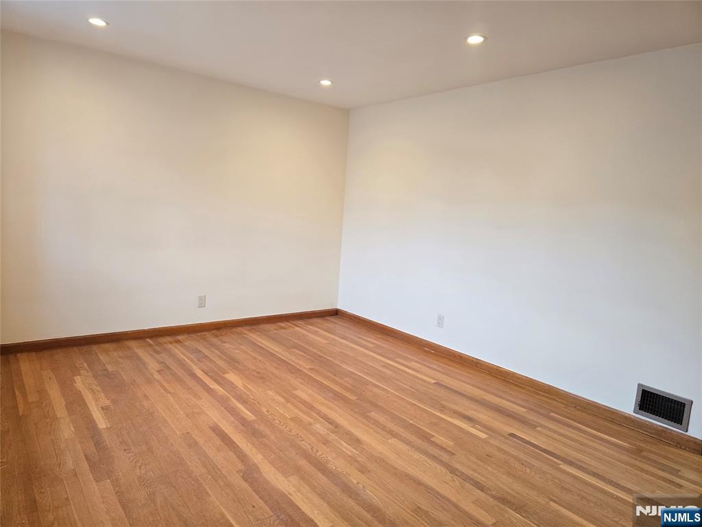 701 4th Street Secaucus, NJ 07094 - Photo 4 of 21 a view of empty room with wooden floor