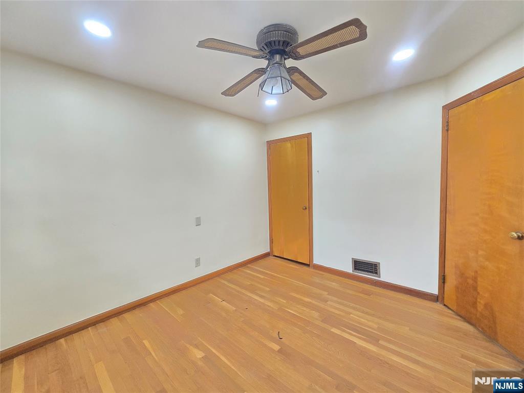 701 4th Street Secaucus, NJ 07094 - Photo 10 of 21 an empty room with a window and a fan