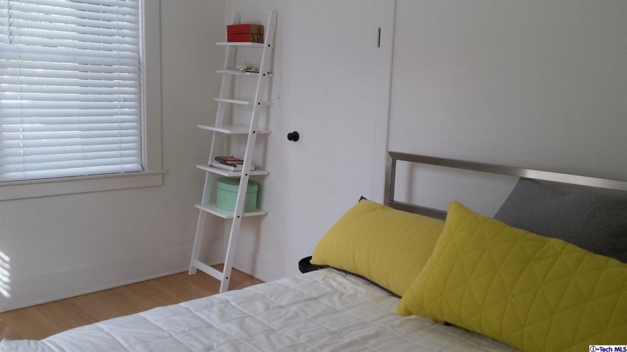 970 Cornell Road Pasadena, CA 91106 - Photo 11 of 14 a bedroom with a bed and a window