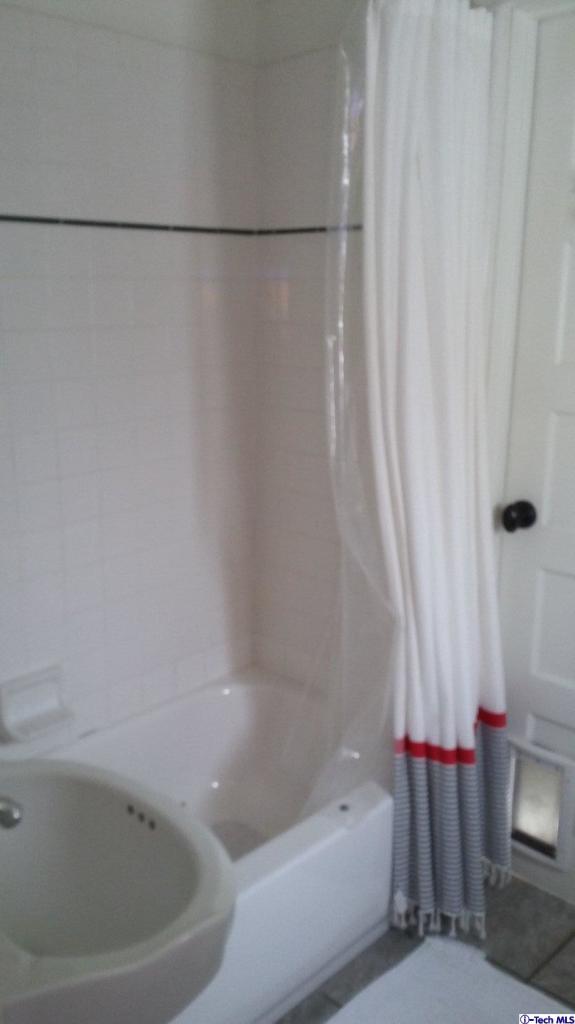 970 Cornell Road Pasadena, CA 91106 - Photo 14 of 14 a bathroom with a bathtub and a shower