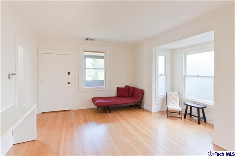 970 Cornell Road Pasadena, CA 91106 - Photo 4 of 14 a living room with furniture and a wooden floor