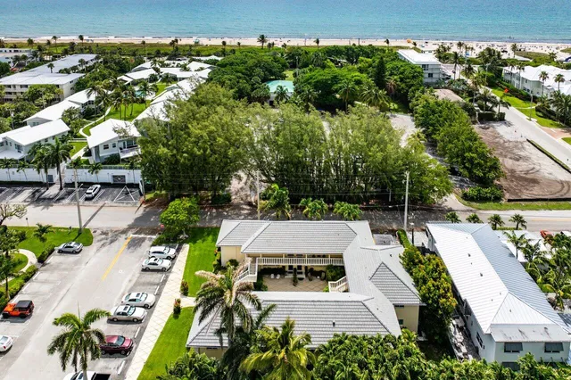 an aerial view of residential houses with outdoor space