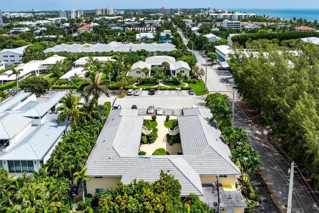 an aerial view of residential houses with outdoor space