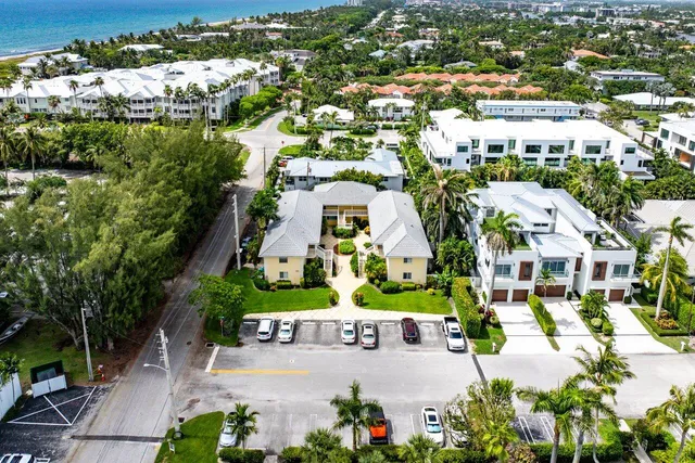 an aerial view of residential houses with city view