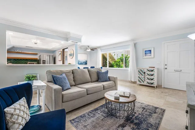 a living room with furniture and a rug