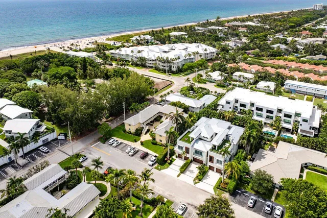 an aerial view of residential houses with outdoor space