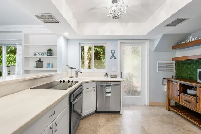 a kitchen with a sink stove and microwave