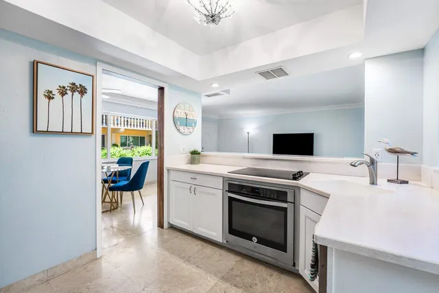 a kitchen with a stove and a refrigerator