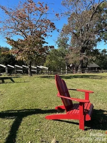 a view of a swimming pool with a yard