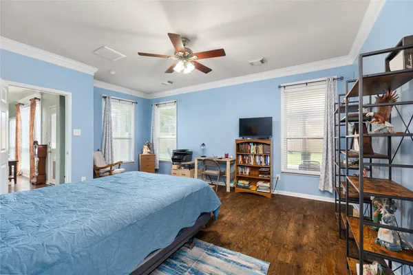 a bedroom with a bed and furniture