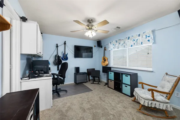 a living room with furniture and decor