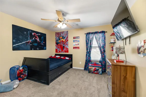 a bedroom with a bed and a dresser