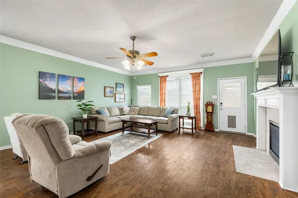 a living room with furniture and a fireplace