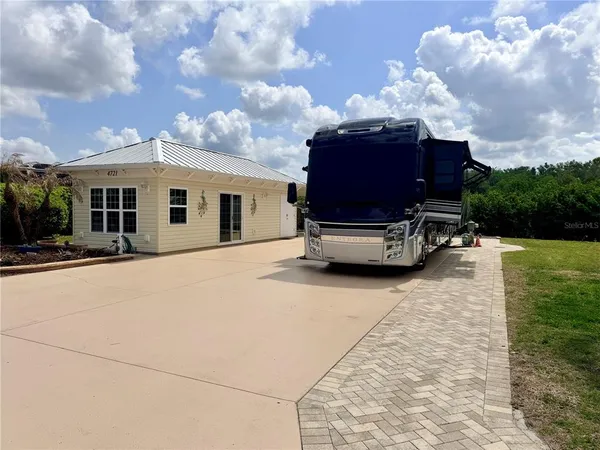 a view of a patio with a yard