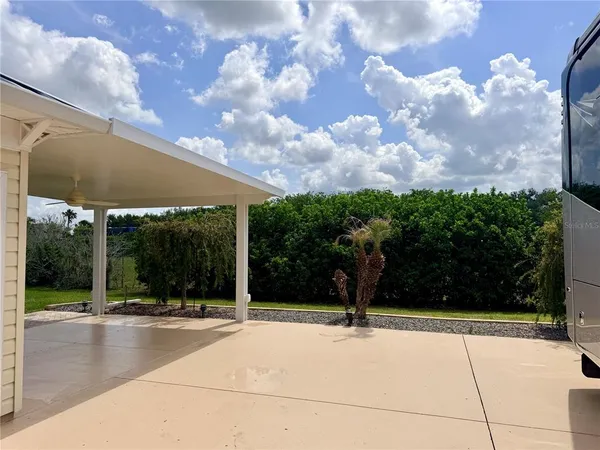 a view of a backyard of the house