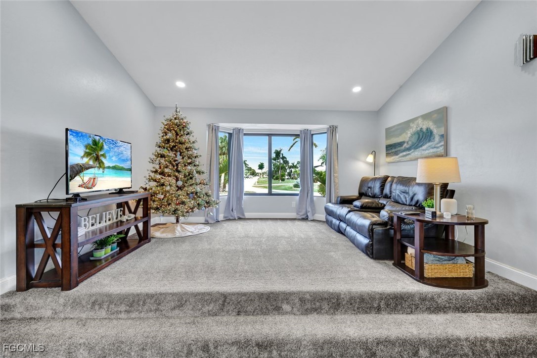 5346 Southwest 10th Avenue Cape Coral, FL 33914 - Photo 26 of 50 a living room with furniture and a flat screen tv