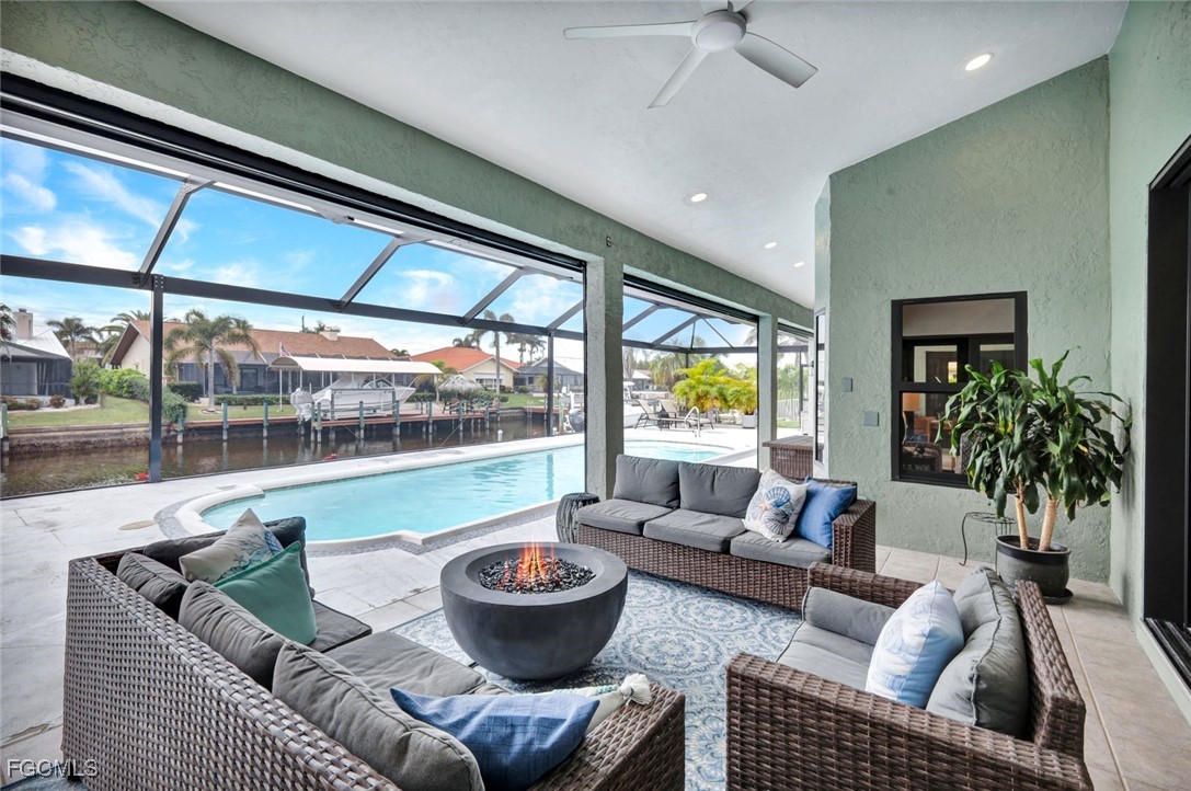 5346 Southwest 10th Avenue Cape Coral, FL 33914 - Photo 29 of 50 a living room with furniture and a potted plant