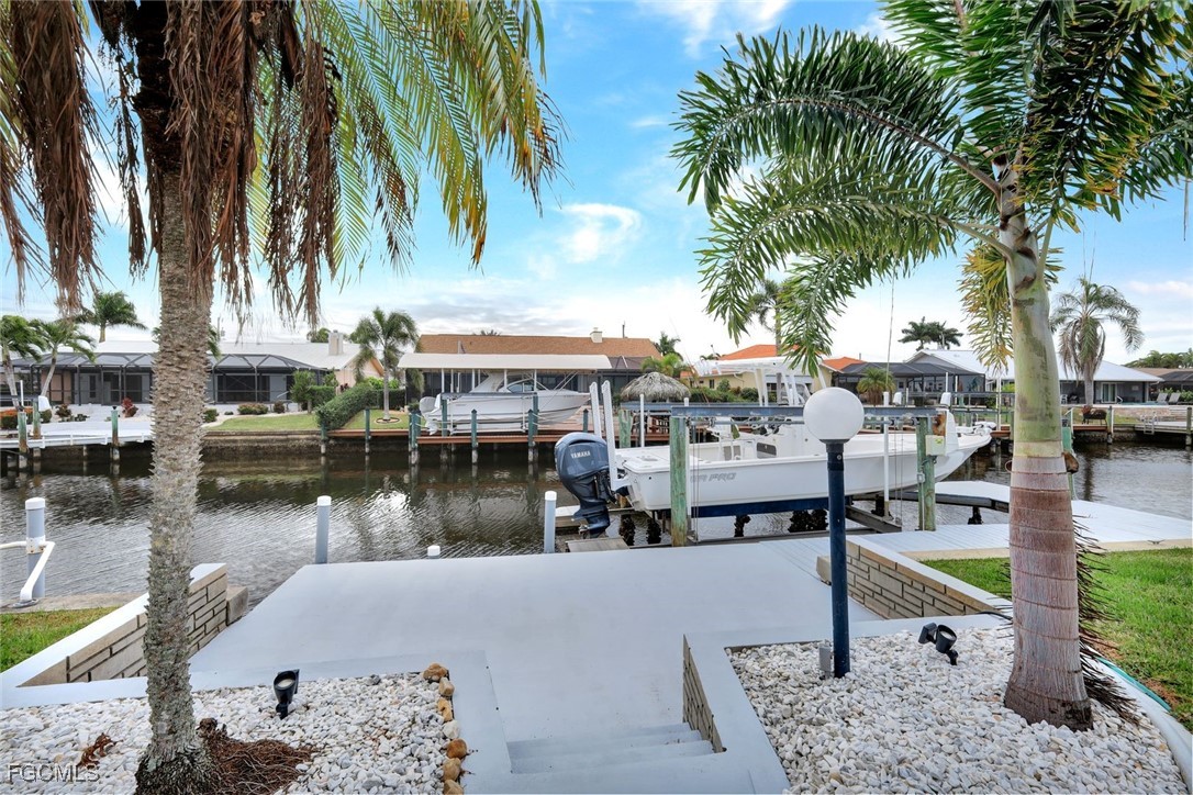 5346 Southwest 10th Avenue Cape Coral, FL 33914 - Photo 38 of 50 a lake view with palm trees