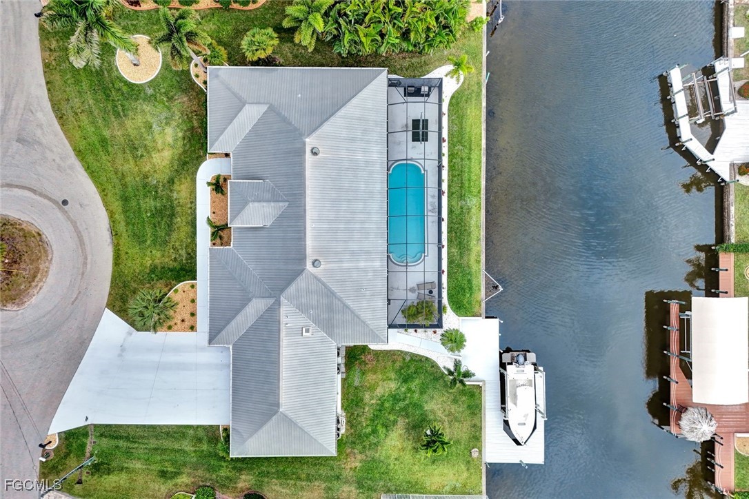 5346 Southwest 10th Avenue Cape Coral, FL 33914 - Photo 48 of 50 an aerial view of a house with garden space and sitting space