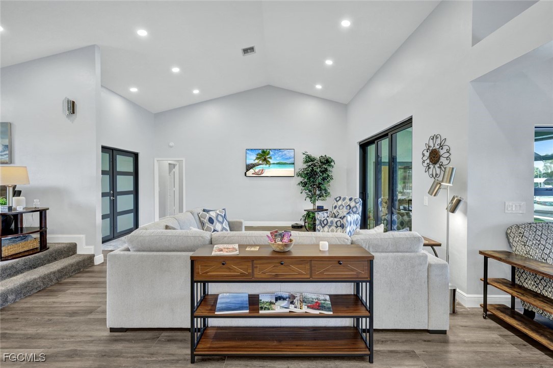 5346 Southwest 10th Avenue Cape Coral, FL 33914 - Photo 6 of 50 a living room with furniture and a table
