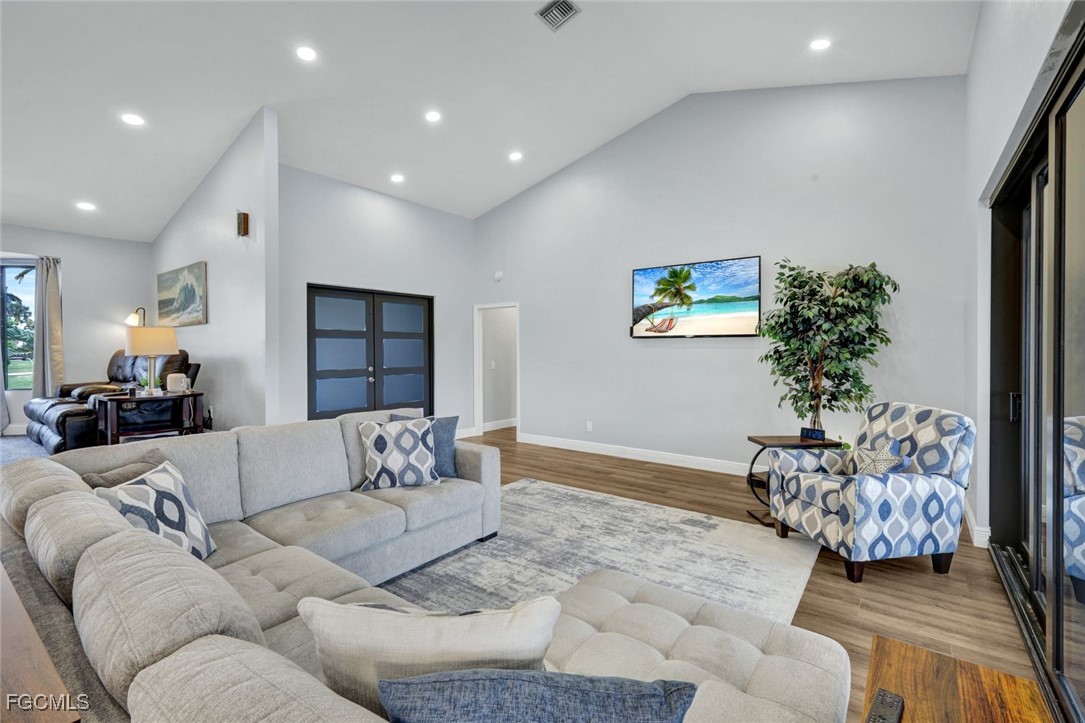 5346 Southwest 10th Avenue Cape Coral, FL 33914 - Photo 7 of 50 a living room with furniture flowerpot and a couch