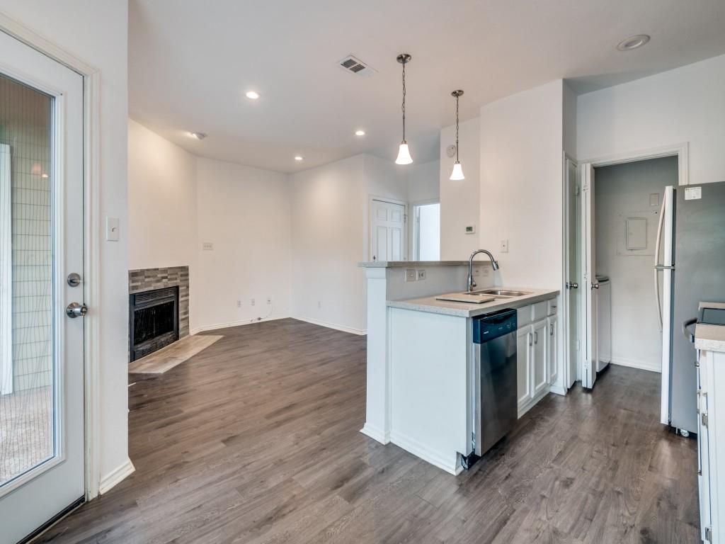4113 Esters Road, Unit 605 Irving, TX 75038 - Photo 1 of 8 a kitchen with stainless steel appliances granite countertop a stove a sink and a refrigerator