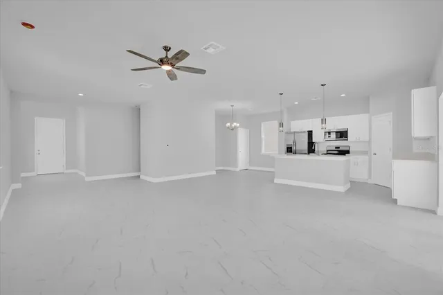 a view of a kitchen with a sink and cabinets