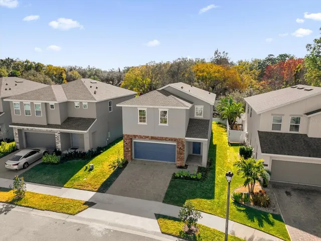 a aerial view of a house with swimming pool and porch